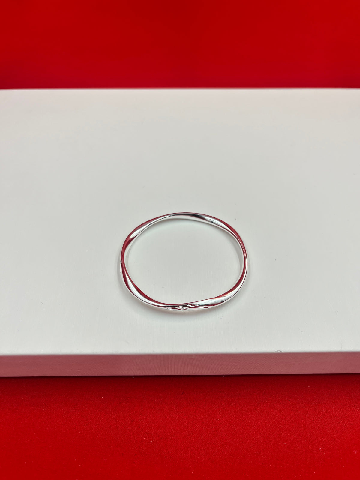 Elegant Twister Silver Bangle 2.2